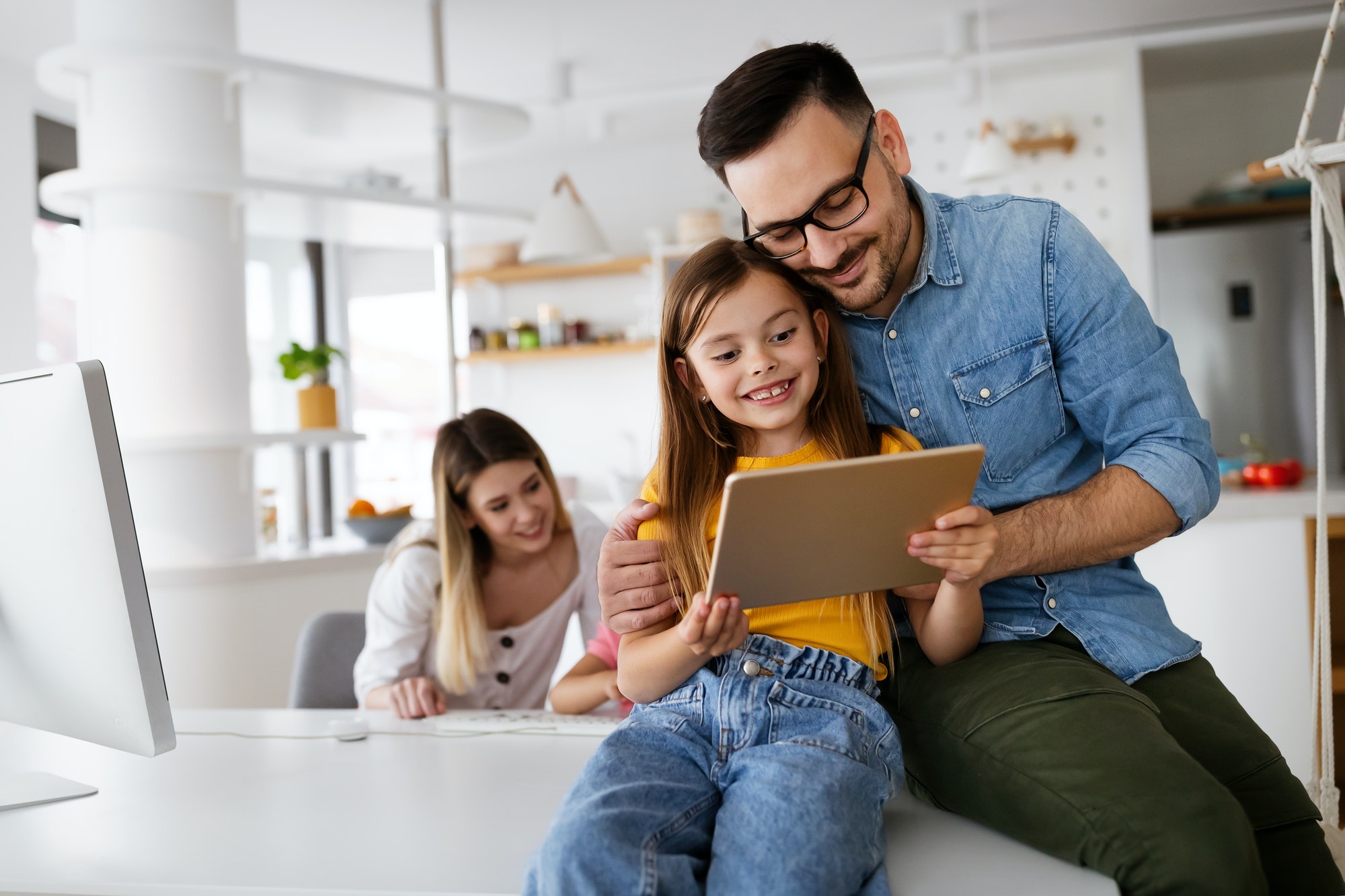 Happy family spending time at home and using digital, technology devices